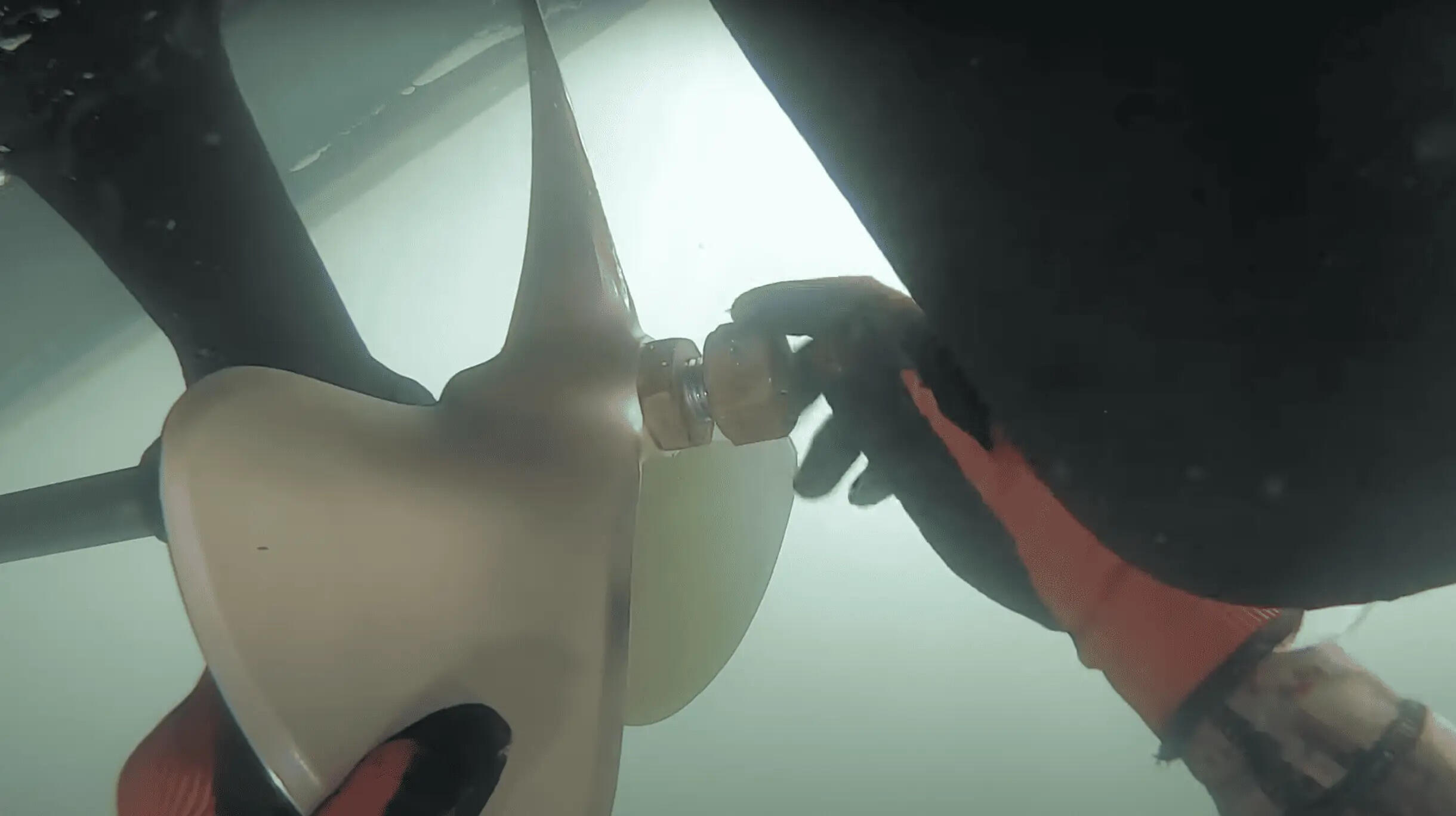 diver installing propeller diver re-installs propeller after propeller was previously removed for repair in marina del rey, CA